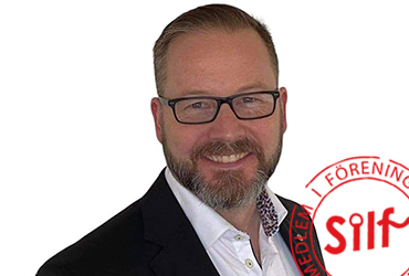 Bild på Stefan Wallsten mot vit bakrund